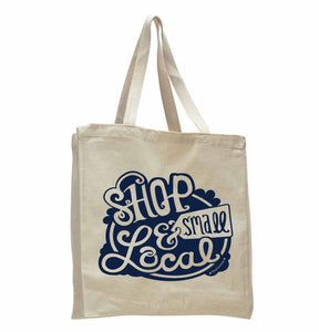 Natural Canvas tote bag with navy blue, hand lettered text saying "Shop Small & Local"